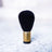 黒い毛先と真鍮の金具を持つH PRODUCT The BRUSHのブラシヘッド、単体で撮影された部品